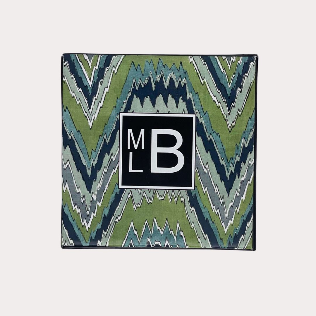 Martyn Lawrence Bullard Hindu Temple candle in clear glass jar, infused with exotic spices and floral notes reminiscent of sacred temples